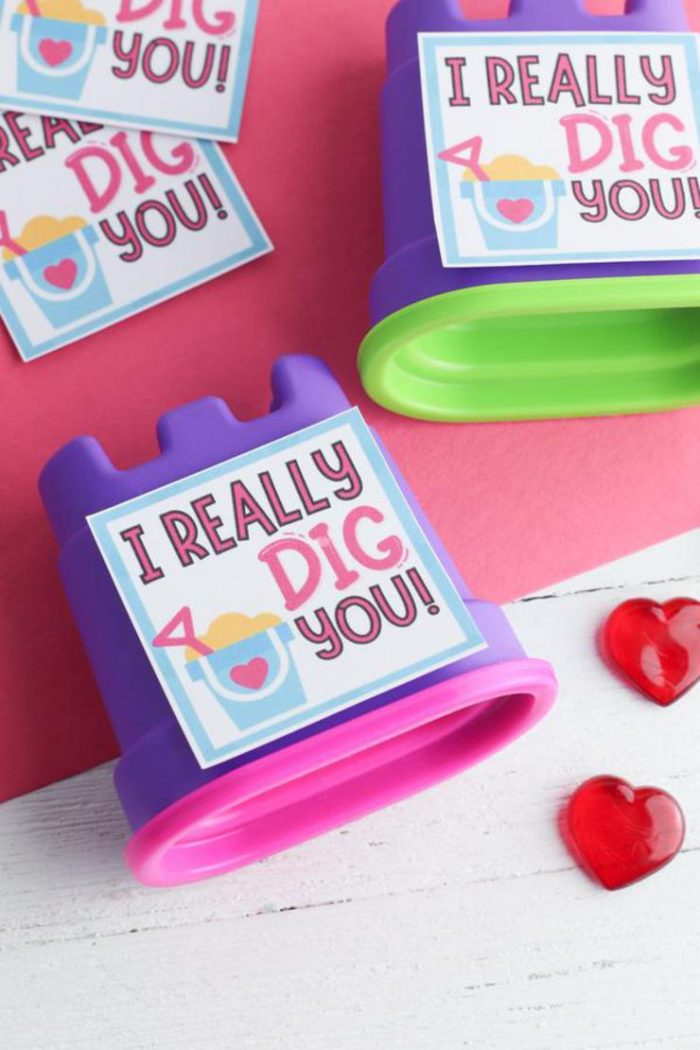 Kinetic sand containers with valentines messages on them. 